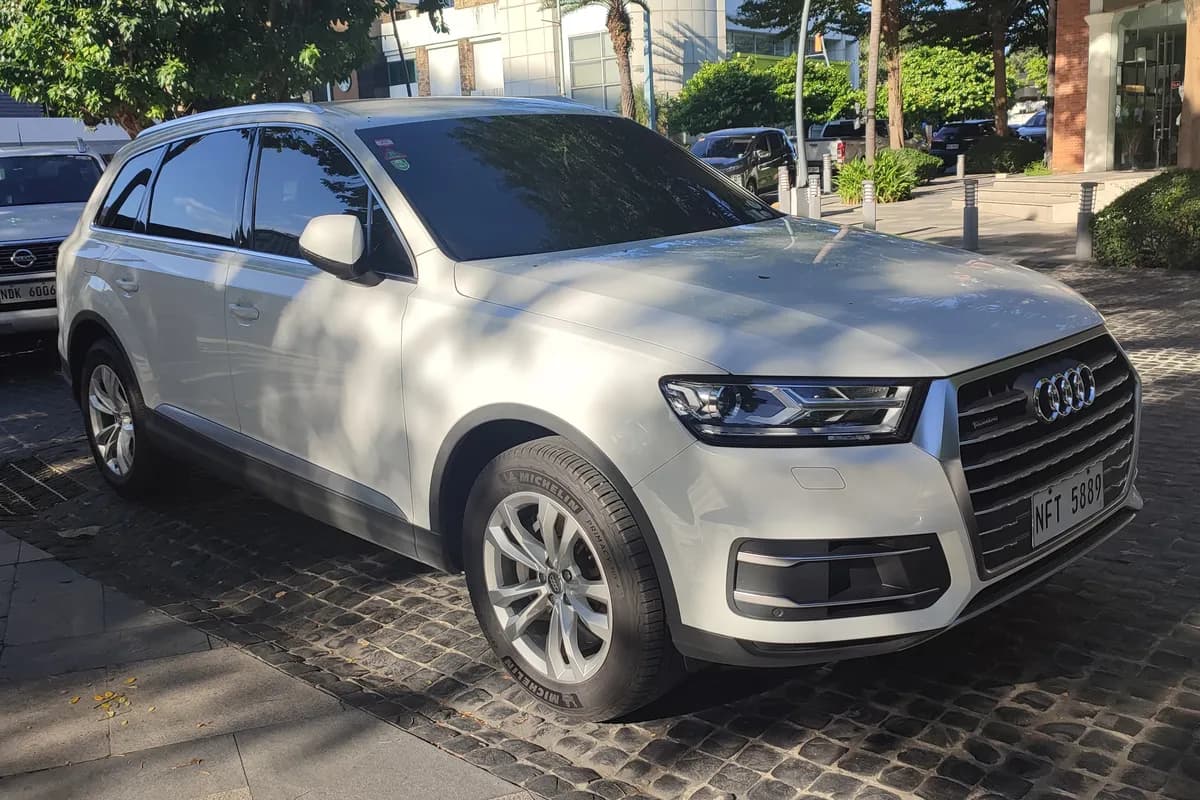 A white Audi Q7 SUV, front three-quarter view