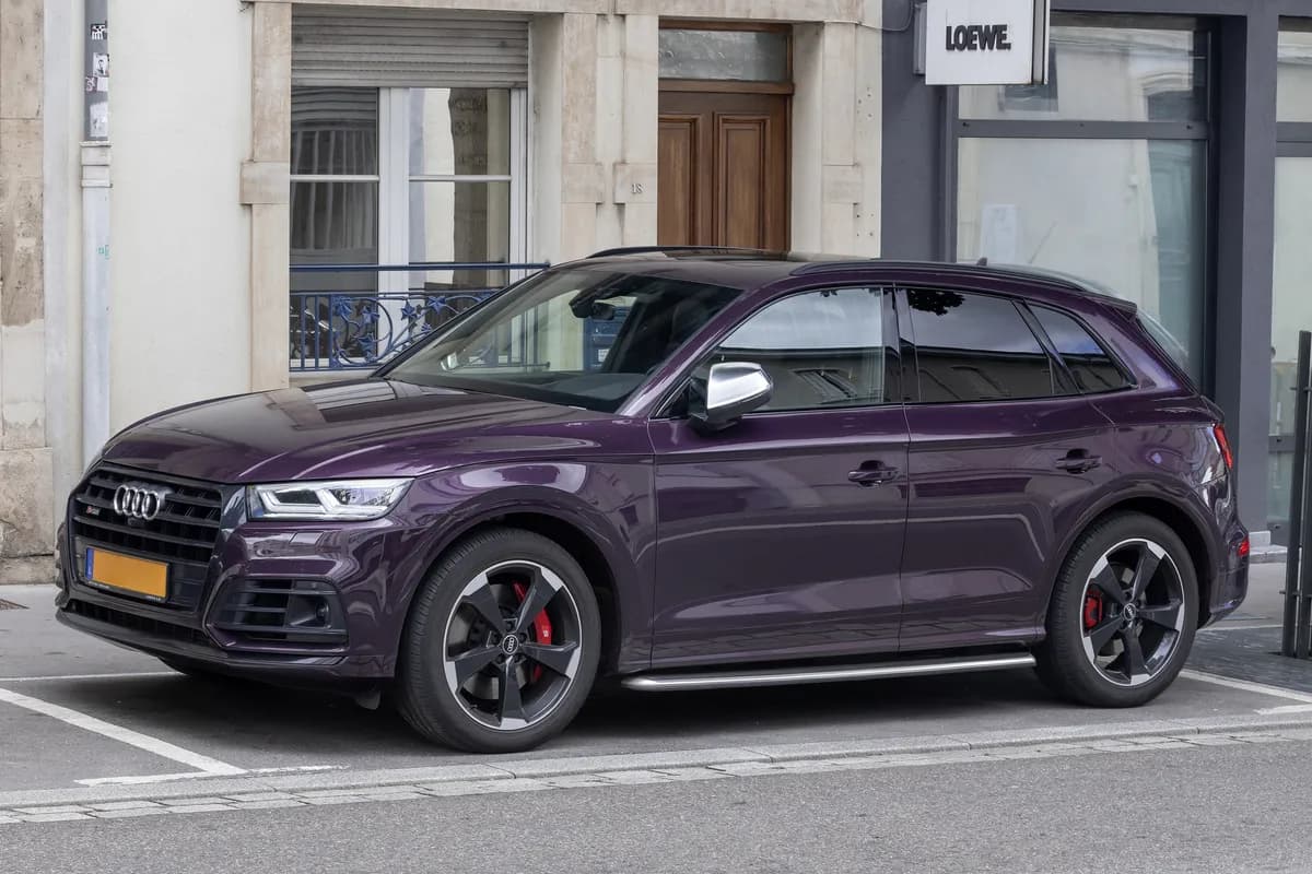 A purple Audi SQ5 SUV, front three-quarter view