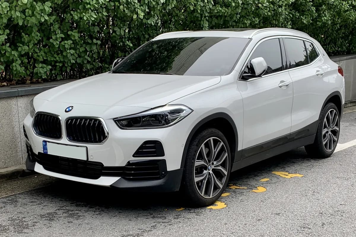 A white BMW X2 SUV, front three-quarter view