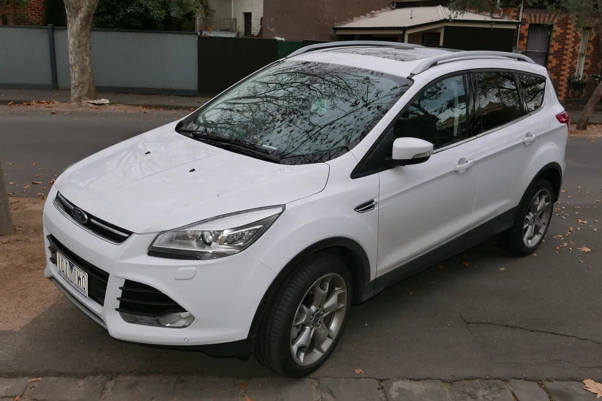 A white Ford Kuga SUV, front three-quarter view