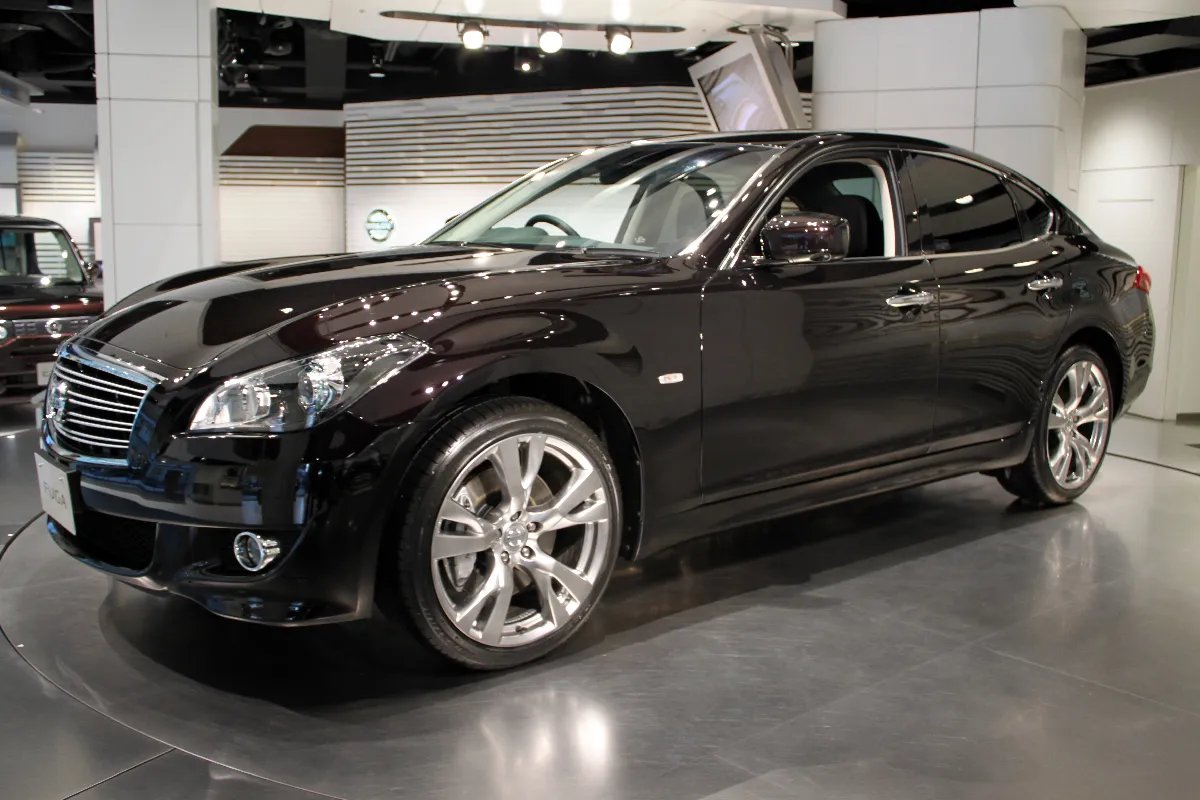 A black Nissan Fuga sedan, front three-quarter view