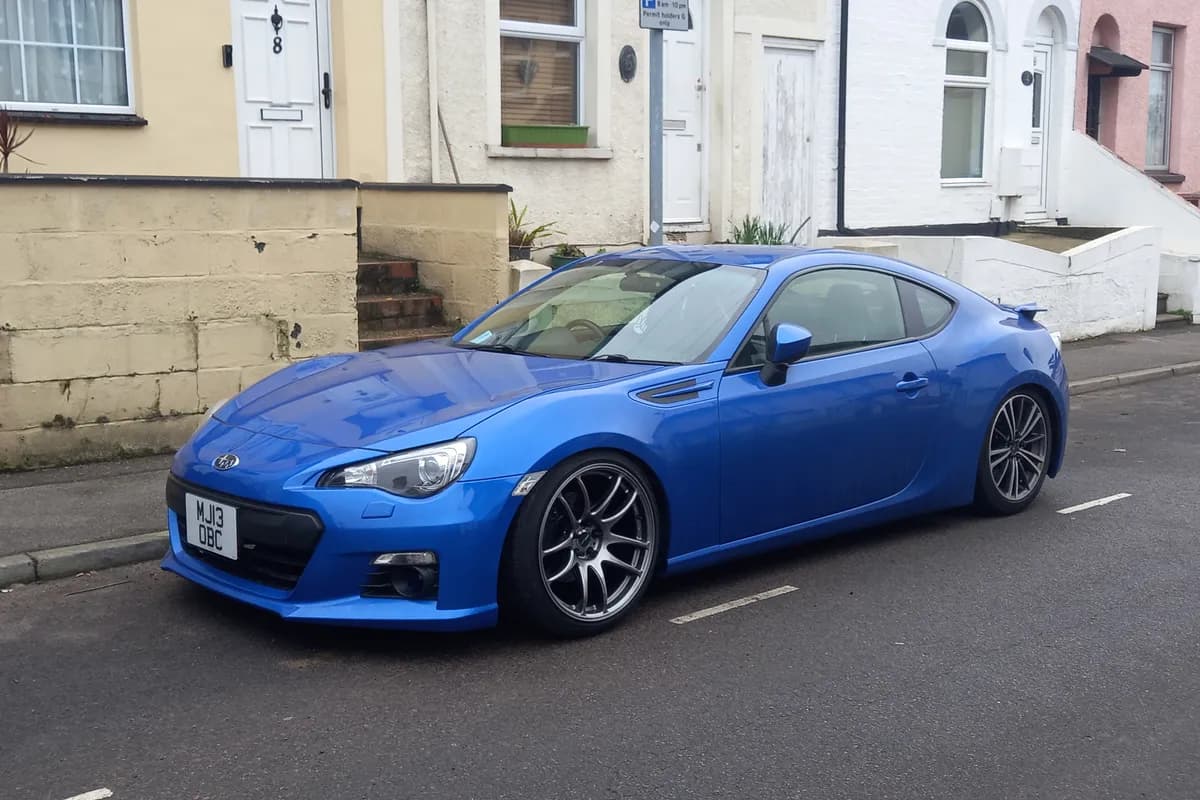 A blue Subaru BRZ coupe, front three-quarter view