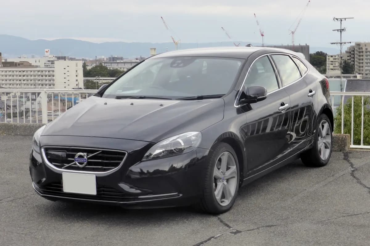 A black Volvo V40 hatchback, front three-quarter view